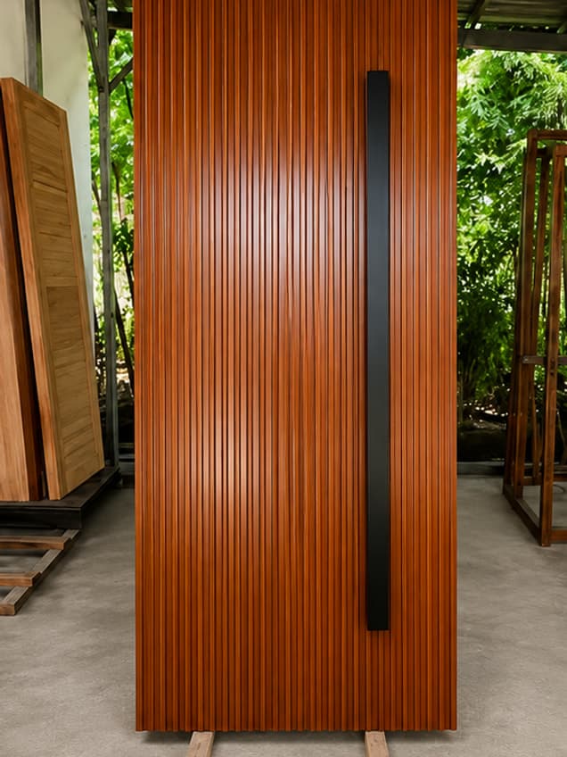 The Flutted-25 door by OLAZO Furniture — closely fluted, with a long black bar handle