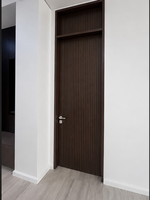 The Flutted Transome door by OLAZO Furniture — a dark fluted door under a matching fluted transom