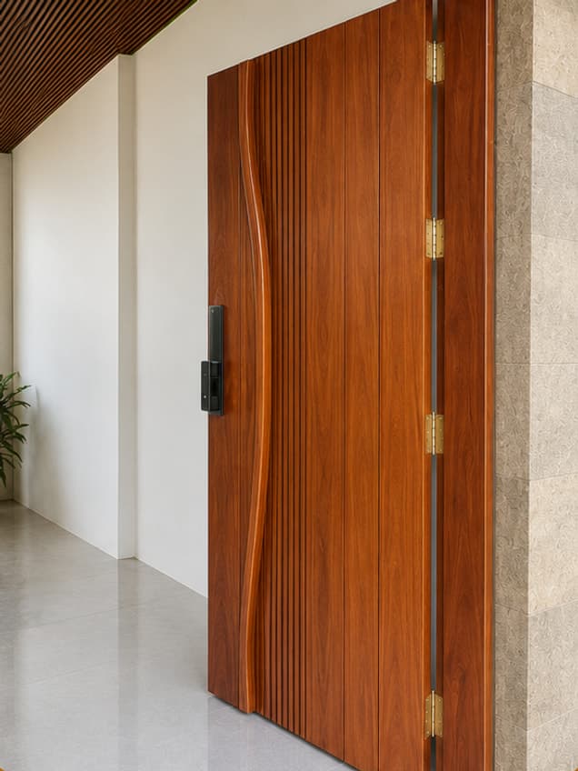 The January door by OLAZO Furniture — carved with a curved edge running down the face