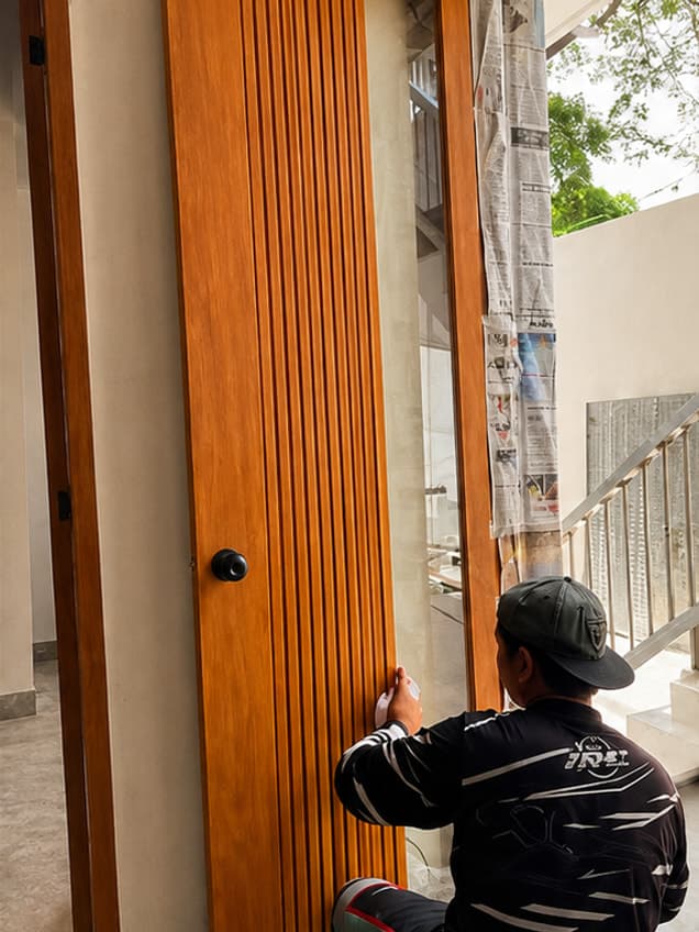 The October-6 door by OLAZO Furniture — a fluted door fitted into its frame on site